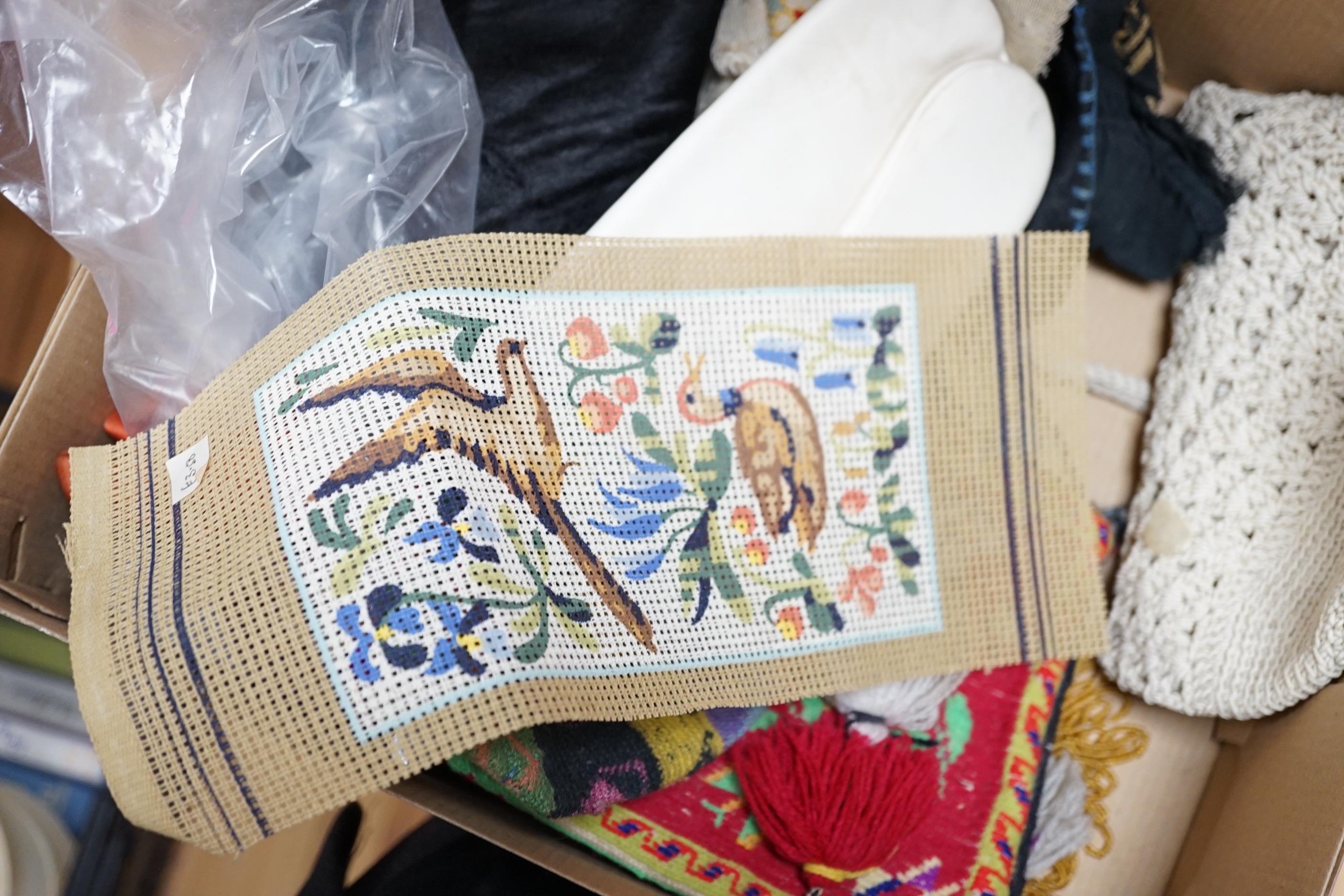 A collection of 20th century embroidered bags, a patchwork pin cushion, a beadwork mat, etc.